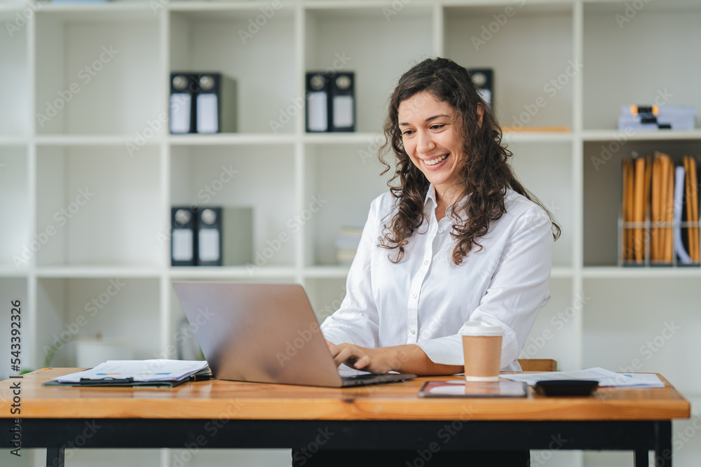 creative business woman using laptop and working in office creative business woman using laptop and working in office