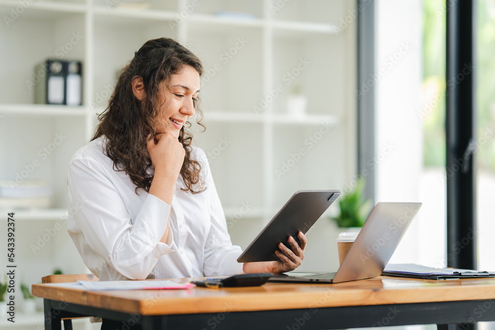 creative business woman using laptop and working in office creative business woman using laptop and working in office