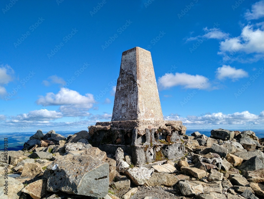 A summit marker in the mountains