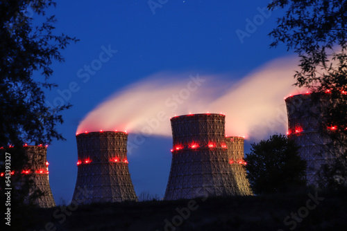 Nuclear power plant cooling towers in the night
