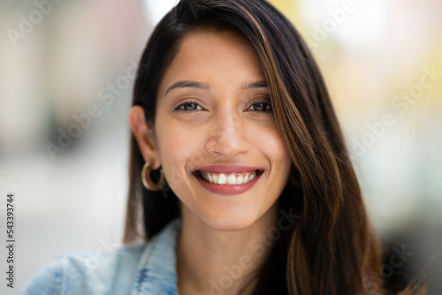 front portrait beautiful woman smiling outdoors