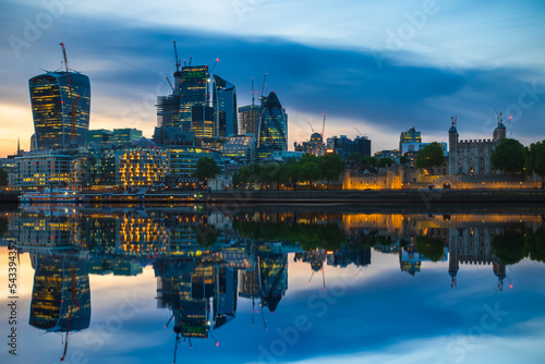 London cityscape with reflection from river Thames during sunset