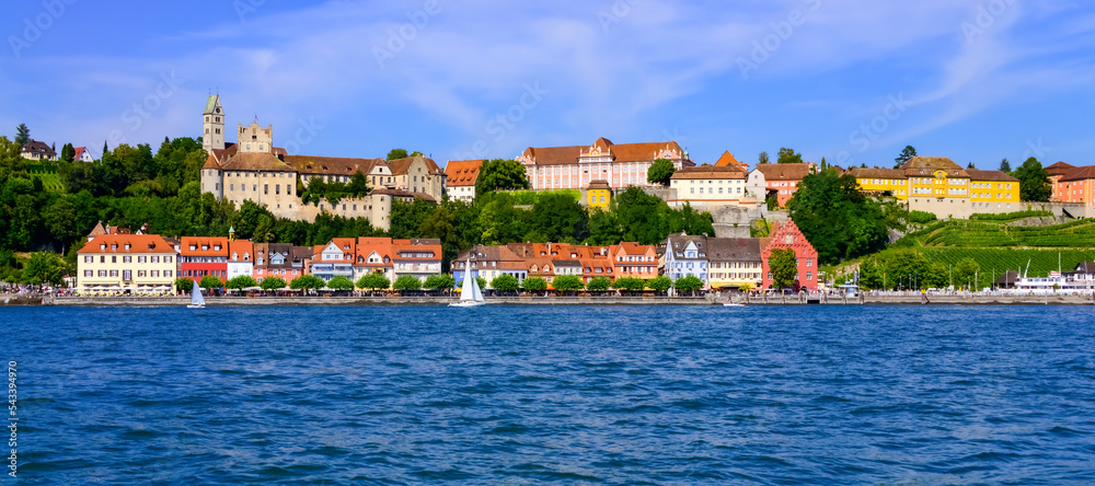 Meersburg panorama on the northern shore of Lake Constance Germany. Colorful city with castle and waterfront houses on a summer day. Historic old town is a major tourist and vacaction destination.