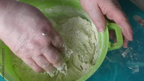 the cook kneads the dough for pies. healthy food concept