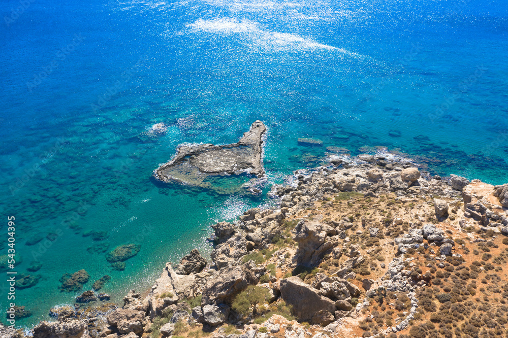 Drone photography of a peaceful rocky coastline and beautiful turquoise waters.
Mediterranean Sea, Rhodes Island, Greece.