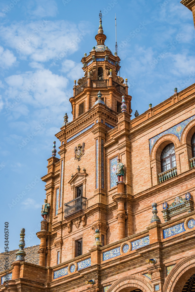 Brick facade detail, tower and decoration with statues of the Palace of Plaza de España, Seville SPAIN
