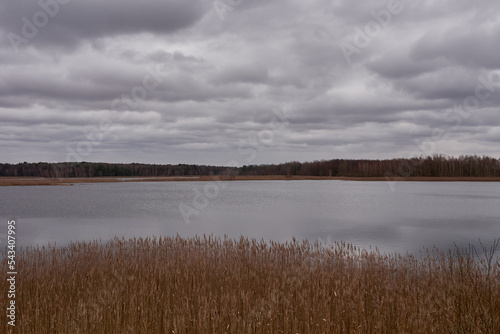 Cloudy sky over the autumn lake