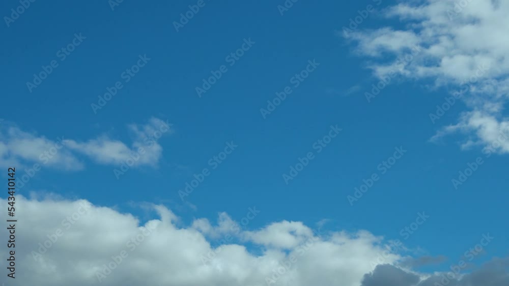 Time Lapse Blue Clear Sky and Puffy Clouds at Noon. Summer Cloudy Clear Skyscraper. Spring Blue Sky and Cumulus Clouds, Skyscrapers, Atmosphere, Air, Height, Beauty. Time Lapse Blue Clear Sky and Puffy Clouds at Noon. Summer Cloudy Clear Skyscraper. Spring Blue Sky and Cumulus Clouds, Skyscrapers, Atmosphere, Air, Height, Beauty.