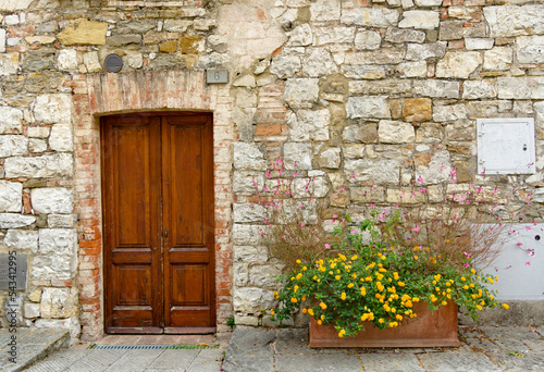 Entrance of a house in the village of Castelnuovo Berardenga Siena Tuscany Italy photo