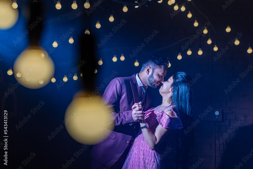 A young Indian couple shooting their pre wedding at a famous studio in