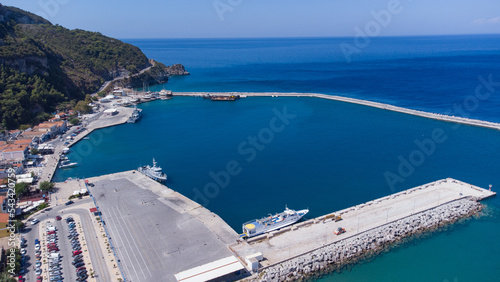 Aerial footage of shipyard in Karlovasi, Samos island behind wave breakers on a clear summer morning photo