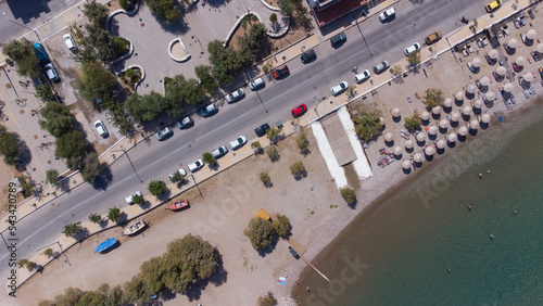 Aerial top view of Karlovasi sea side in the Island of Samos with cars parked on the nearby street photo