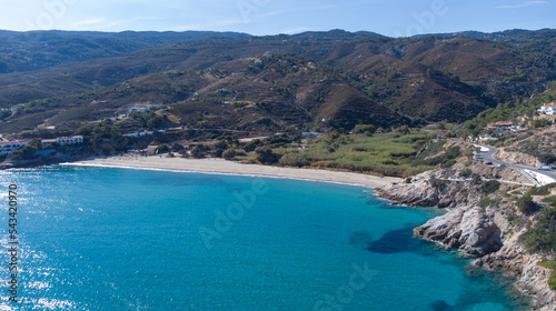 Fototapeta Naklejka Na Ścianę i Meble -  Aerial view of lovely greek fisher town of Armenistis in a quiet summer morning. Port with local beach in transparent clear water at Ikaria, Greece