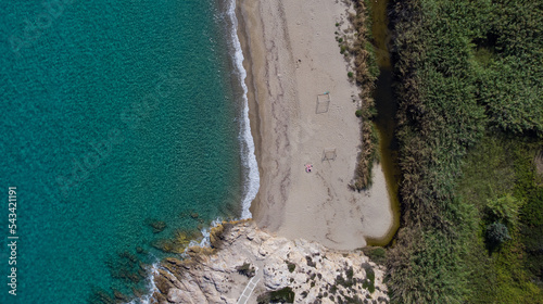 Aerial top view of Livadi Beach at the Ikaria island in a quiet summer day with blue clear water photo