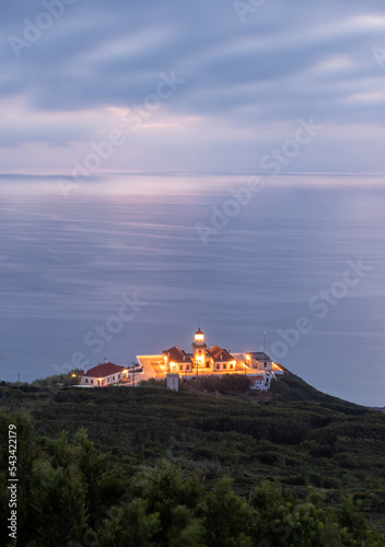 View over the Cape Mondego lighthouse in Figueira da Foz in Portugal at dusk. photo