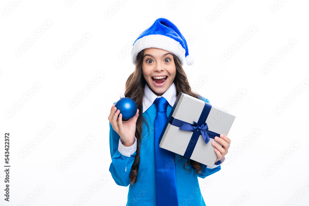 Excited kids face. Child with gift present box on isolated background. Presents for birthday, Valentines day, New Year or Christmas. Amazed expression, cheerful and glad. Excited kids face. Child with gift present box on isolated background. Presents for birthday, Valentines day, New Year or Christmas. Amazed expression, cheerful and glad.