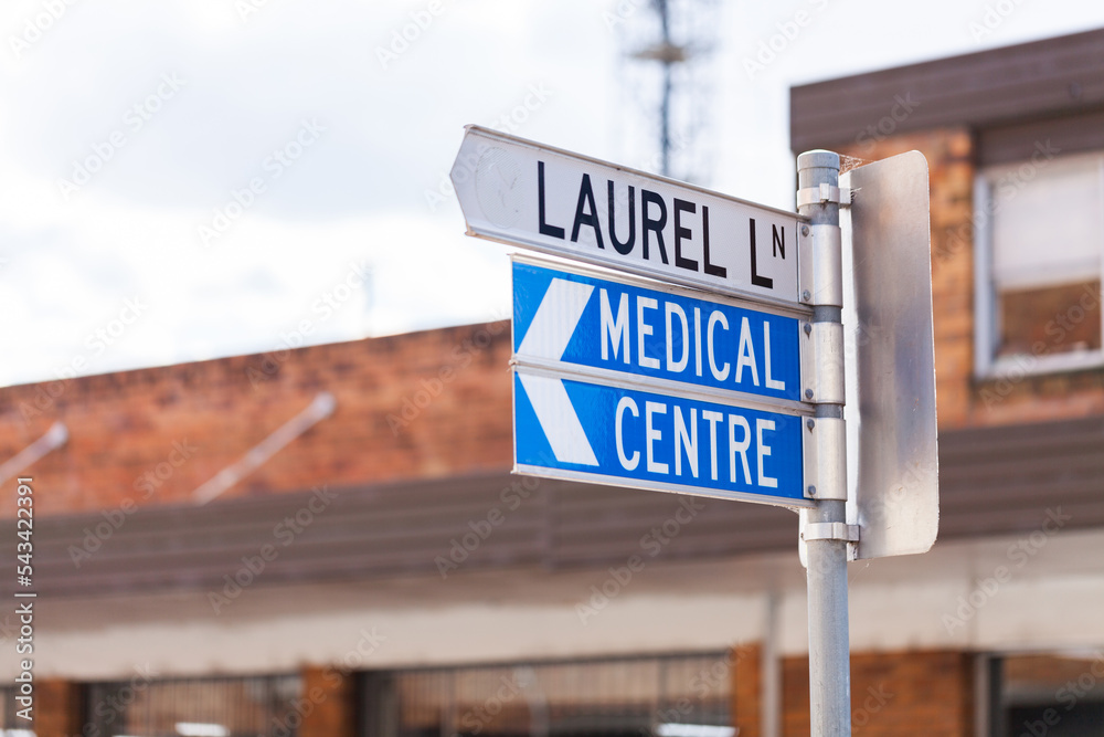 Street road sign to medical centre down laurel lane Street road sign to medical centre down laurel lane