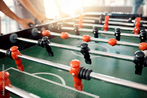 Foto People hands, foosball table and competition in arcade with retro games, soccer action board and plastic toys for team play