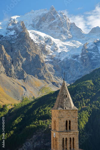 The Meije Peak viewed from Les Terrasses village in Ecrins National Park, Romanche Valley, Hautes Alpes (French Southern Alps), France, with the bell tower of the church in the foreground