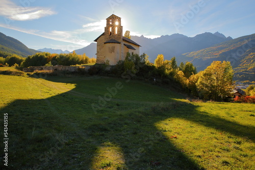The chapel of Villard Saint Pancrace, located on a hill near Briancon, Hautes Alpes (French Southern Alps), France, surrounded by Autumn colors photo