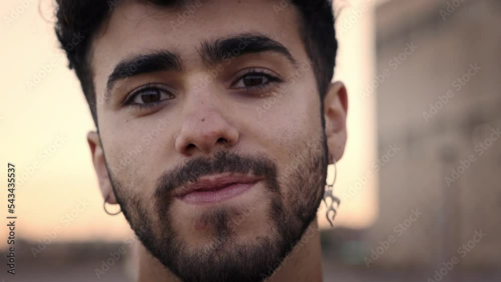 Portrait of a smiling gay man looking at the camera. Cheerful people with positive face. LGBT people. High quality 4k footage Portrait of a smiling gay man looking at the camera. Cheerful people with positive face. LGBT people. High quality 4k footage