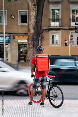 Delivery Man Riding Bike