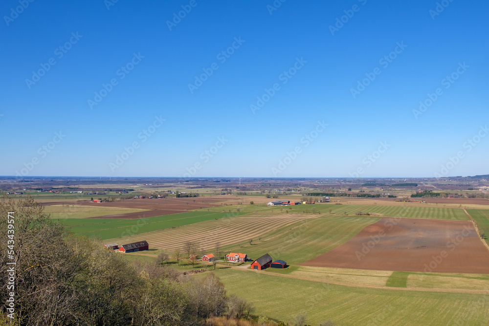 Obraz premium Aerial view of rural landscape in spring with a farm