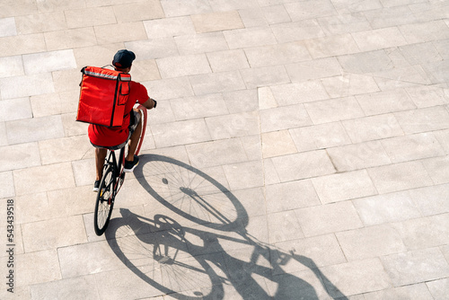 Delivery Man Riding Bike