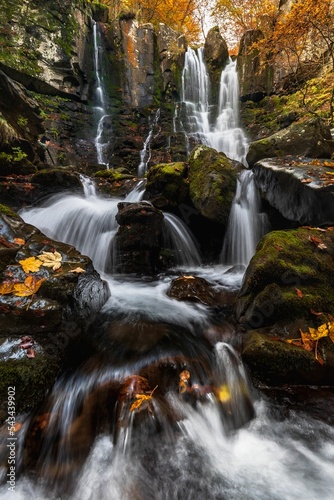 Long exposure of the Dardagna Waterfalls in autumn in the natural park of Corno alle Scale, Italy. photo