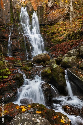 Long exposure of the Dardagna Waterfalls in autumn in the natural park of Corno alle Scale, Italy. photo