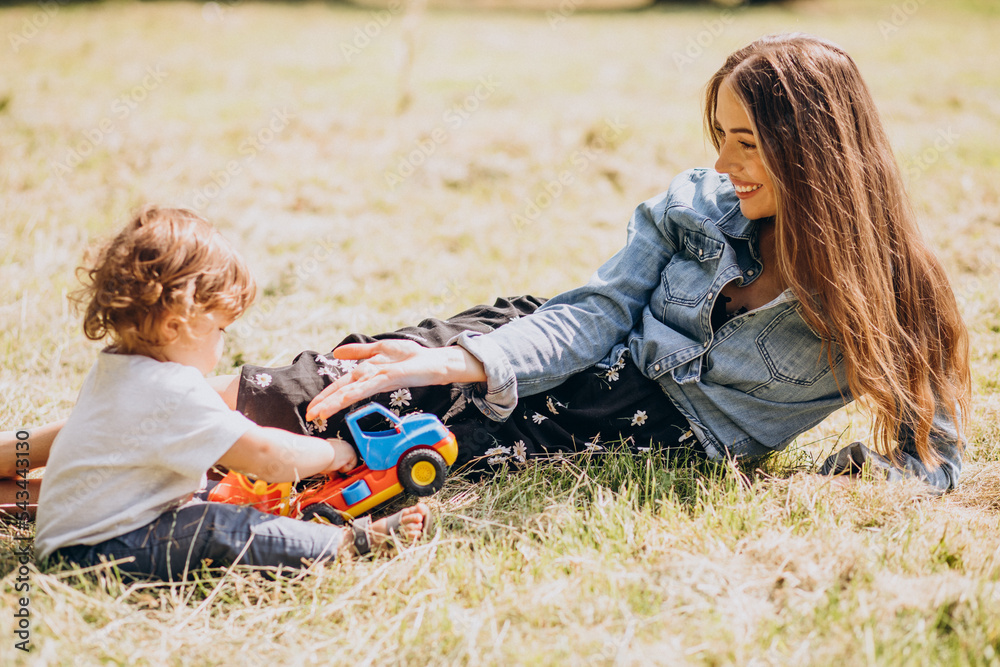 Fototapeta premium Mother with her little son together in park