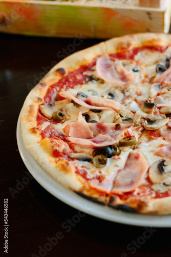 Beautiful pizza with a ham ...