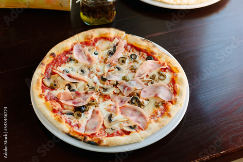 Beautiful pizza with a ham ...
