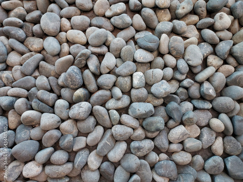 Fototapeta Close-up shot of a large pile of grey stones.