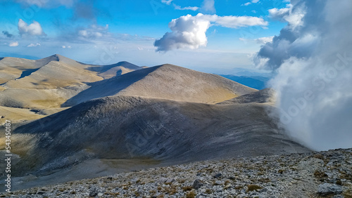 Mystical hiking trail leading to Mount Olympus (Mytikas, Skala, Stefani, Skolio), Mt Olympus National Park, Macedonia, Greece, Europe. Scenic view of cloud covered soft hills and highlands. Hike photo