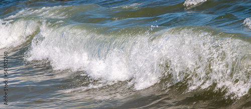 Foto Close up of small waves breaking in the Atlantic Ocean