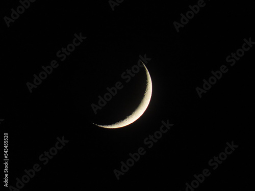 The crescent moon gleams against the midnight sky, its delicate curves a symbol of mystery and beauty