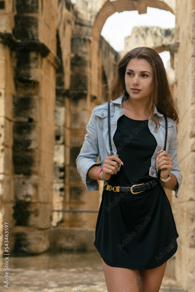 Fashion model girl dressed in black posing in Tunisia. 