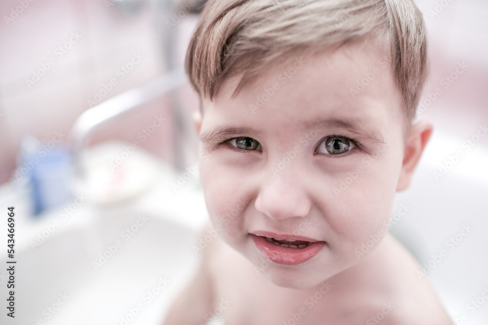 Child kid boy in bathroom. Health care, dental hygiene, people and beauty concept Child kid boy in bathroom. Health care, dental hygiene, people and beauty concept