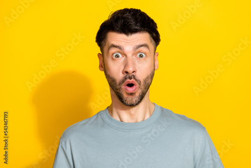 Closeup photo of young funny impressed suprised worker manager brunet man reaction inflation level business crisis isolated on yellow color background photo