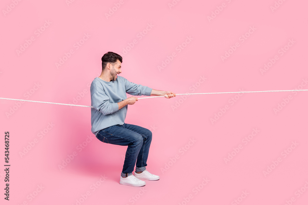 Pull String Off Profile side full body photo of determined guy leader fight tug war ...