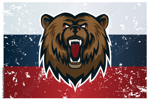 The angry muzzle of a bear with an open mouth on the background of the Russian flag