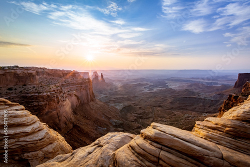 Sunrise at Mesa Arch in Canyonlands National Park Moab Utah from above the archway looking into the canyon valley