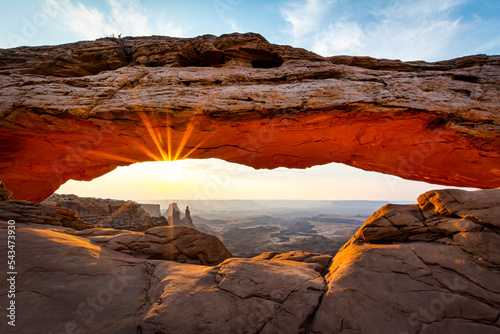 Sunrise at Mesa Arch in Canyonlands National Park Moab Utah with the sun peaking under the arch © Ashwin