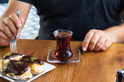 Canvastavla Turkish black tea with custard cakes.