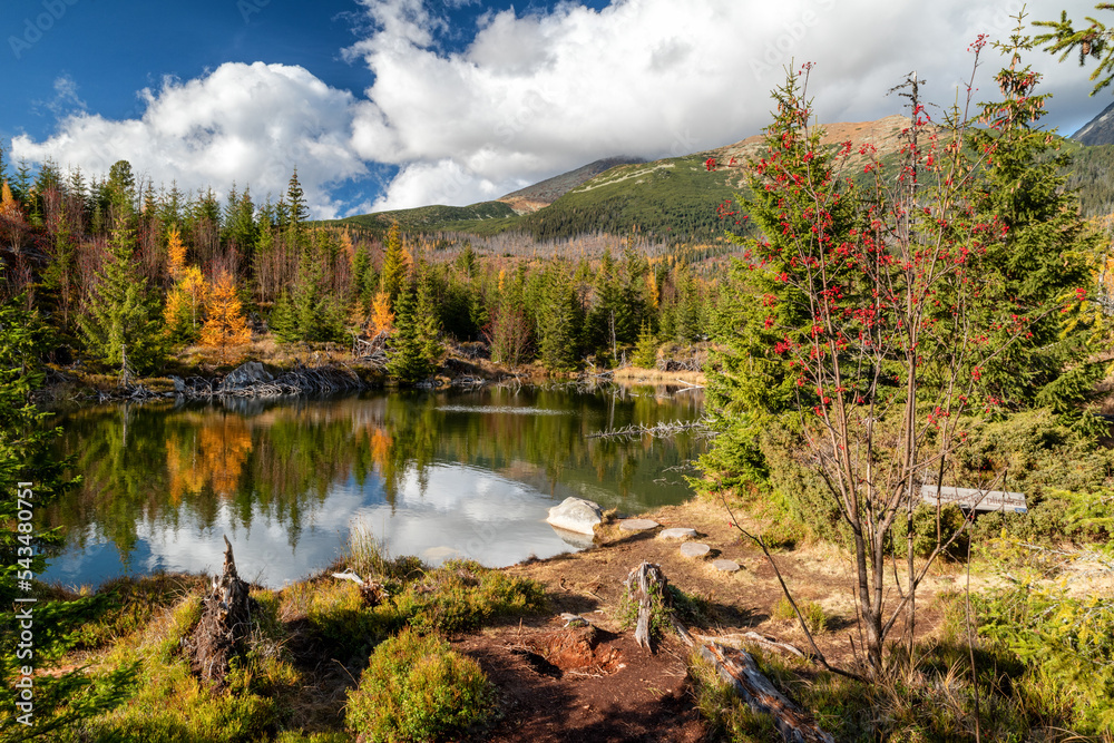 Mountain lake called Rakytovske pliesko in autumn colors in High Tatras mountains in Slovakia Mountain lake called Rakytovske pliesko in autumn colors in High Tatras mountains in Slovakia