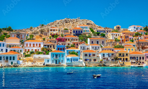 Colorful houses in picturesque small island Halki in Greece