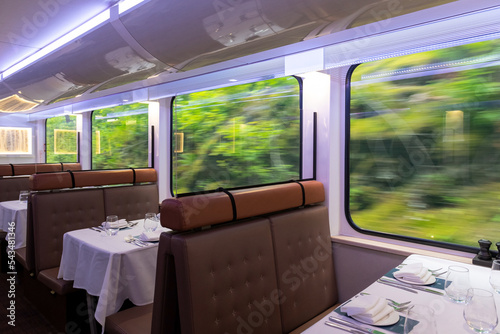 Fotografi Interior of the gold leaf Rocky Mountaineer restoration train wagon while riding in British Columbia, Canada