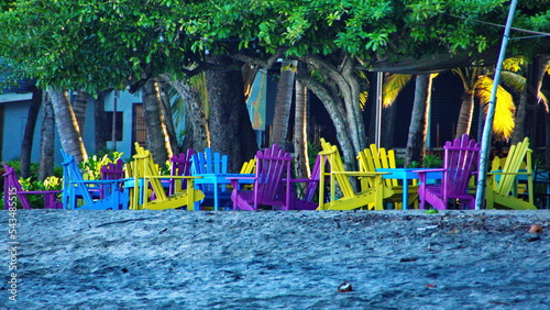 Colorful wooden chairs at a restaurant on the beach in Tamarindo, Costa Rica © Angela