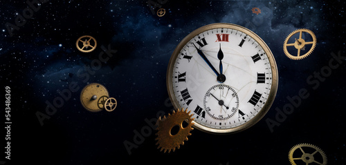 Parts of old antique watches and Roman numberals clock face on the starry night background photo